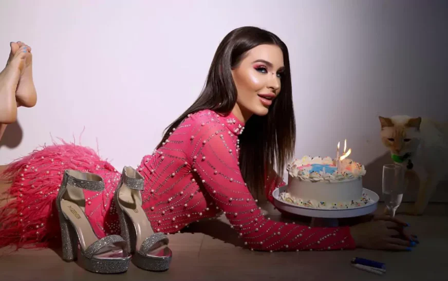 Ella Reese Net Worth celebration photo showing actress and model in pink outfit with birthday cake