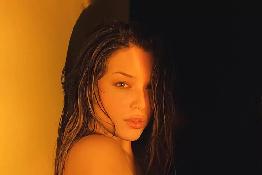 Lauren Summer with wet hair in warm golden light - Lauren Summer Net Worth