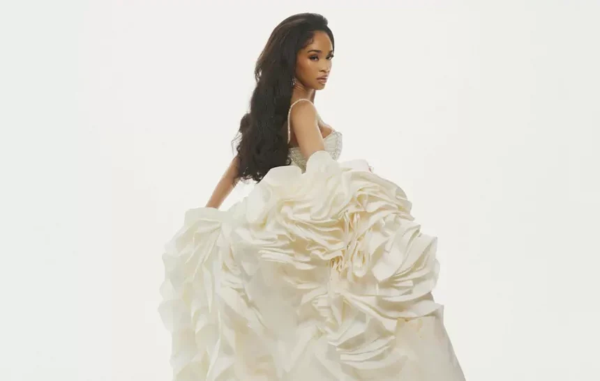 Saweetie wearing a white ballgown, representing her estimated $4 million net worth in 2026