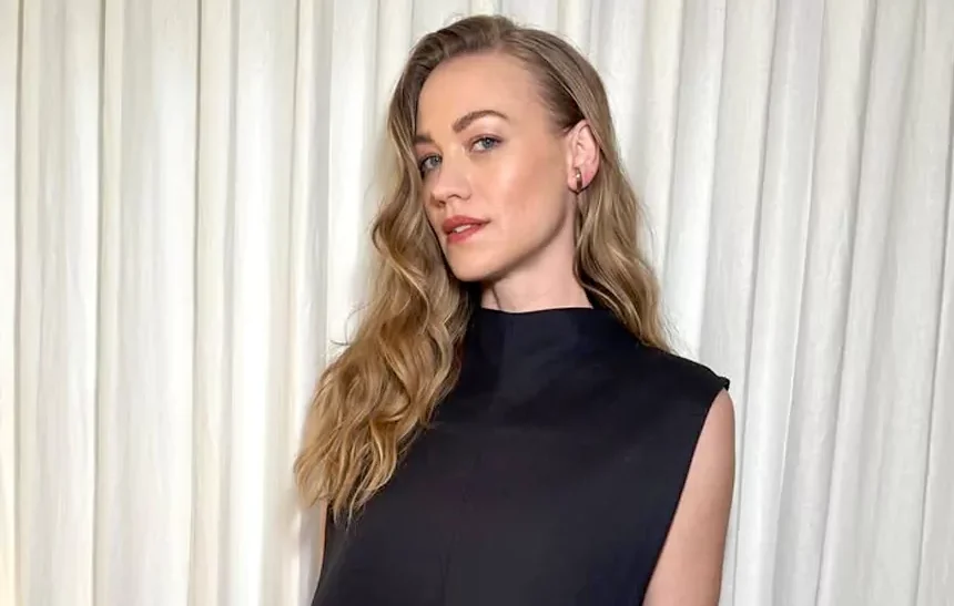 Yvonne Strahovski in a black sleeveless dress at a media event, representing her $12 million net worth career success