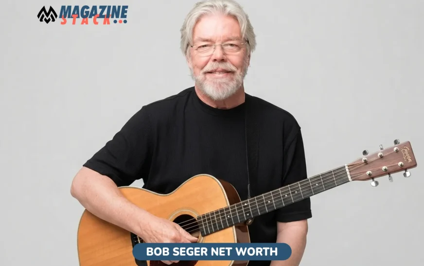 Bob Seger Net Worth: older musician with gray hair and beard playing acoustic guitar
